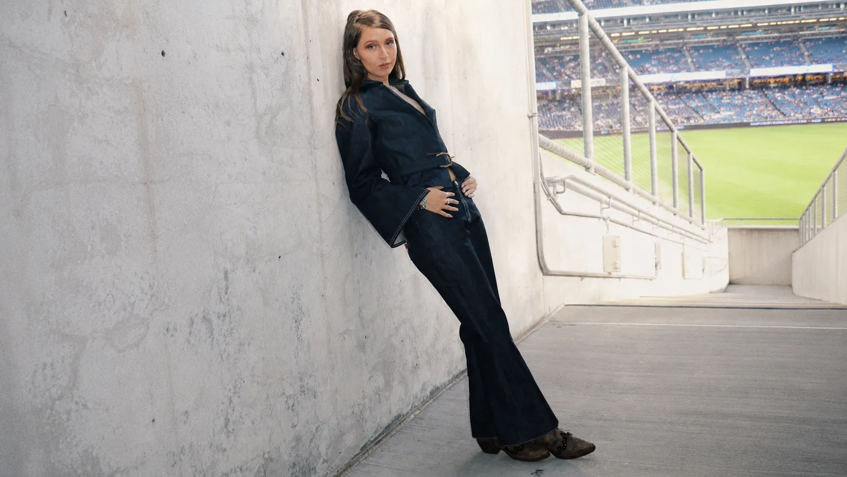 Tailoredbyrose campaign — denim suit at the stadium