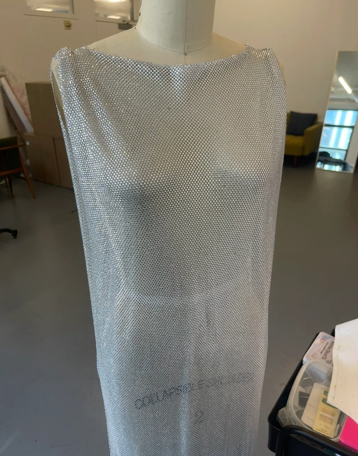 Crystal-mesh gown on the dress form in the atelier